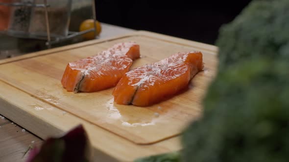 Professional Chef Prepares Fish Steak for Frying