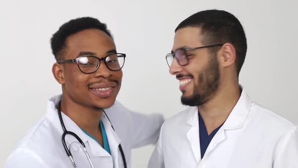 Two African American doctors smiling. The concept of Israeli medicine.