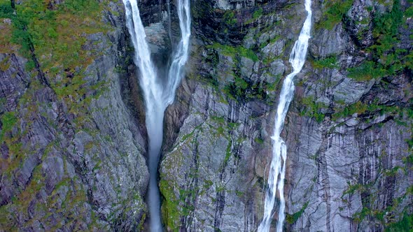 Stunning View of high twin waterfall flowing from a tall mountain