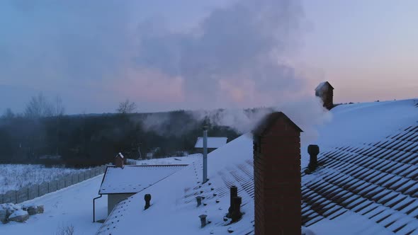 Sunset on Winter Landscape Beautiful Home in the Village the Smoke Comes From the Chimney