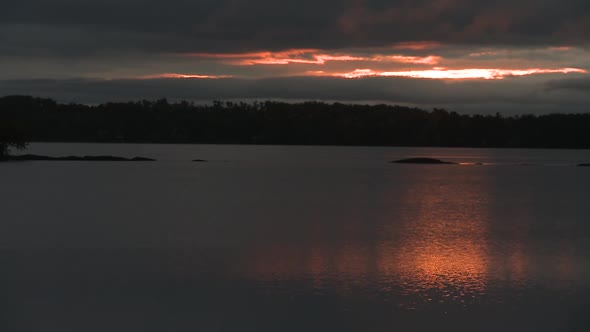 Morning sunrise over fresh water lake.