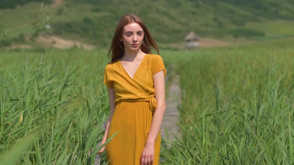 Woman in a reed field