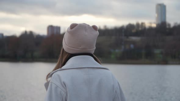 Girl Walks Along the Stunning Embankment