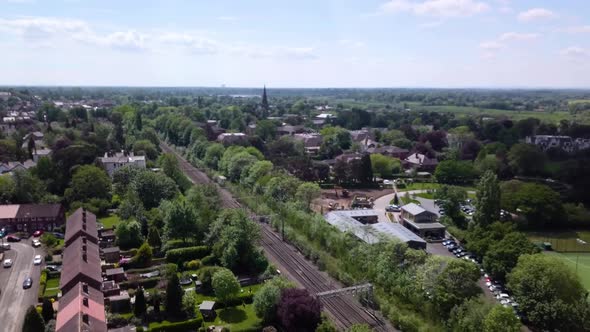 Drone flying over urban landscape in Alderley Edge, Cheshire, UK  - showing suburban greenbelt and a