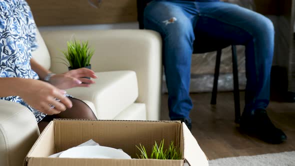 Close Up Couple Unpacking in Their New House