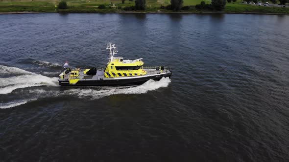 Dutch law enforcement vessel sailing on a river