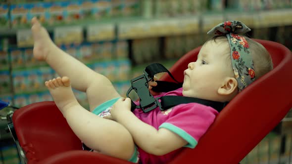 Child is Sitting in a Specially Equipped Chair