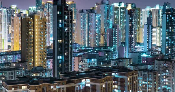 Residential Buildings' Windows Twinkle at Night Time Lapse Urban Cityscape.