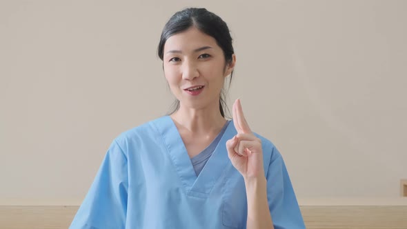 portrait of smart asian female doctor explain and suggesting a way to takecare yourself