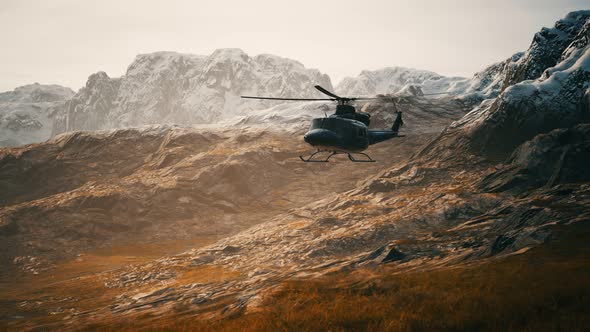 Slow Motion Vietnam War Era Helicopter in Mountains