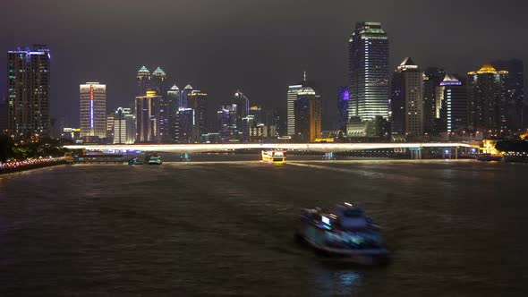 Guangzhou Night Business City Cityscape China Pearl River with Boats Traffic Timelapse Pan Up