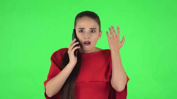 Portrait of Pretty Young Woman Is Upset Speaking on the Phone, Proving Something