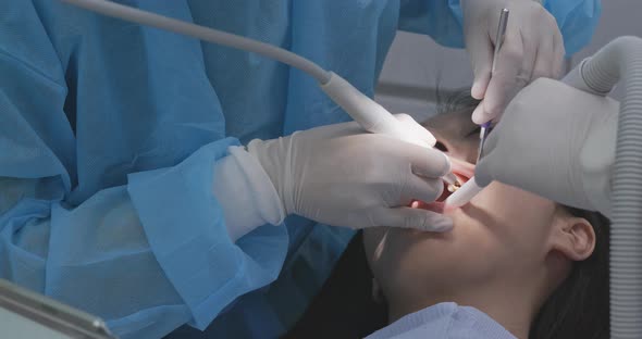 Woman checking on her teeth at dental clinic