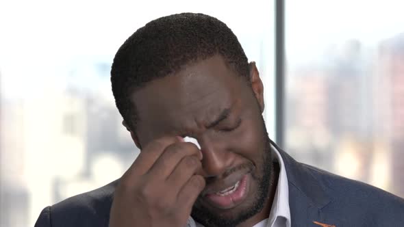 Face of Crying Afro-american Man.