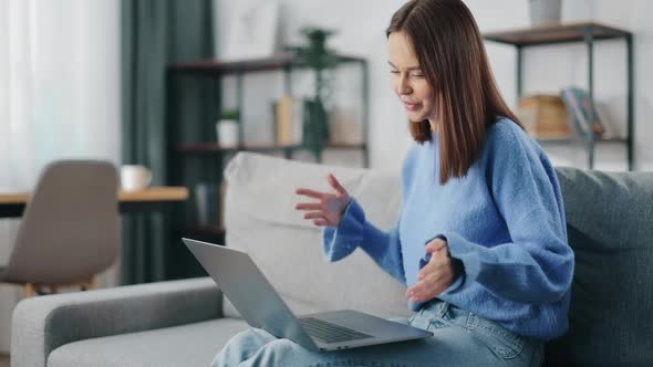 Woman Having Video Call on Laptop