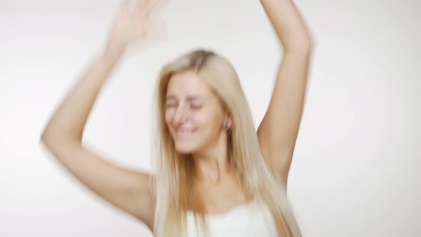 Excited Cute Young Woman with Long Blond Hair Feeling Happy and Succeed Clenching Fist Like Winner