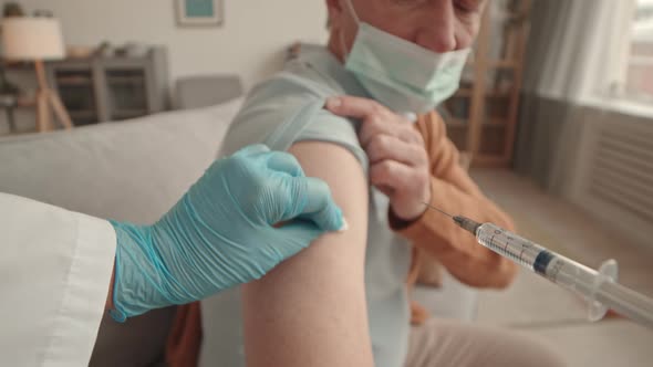 Doctor Giving Injection to Patient POV