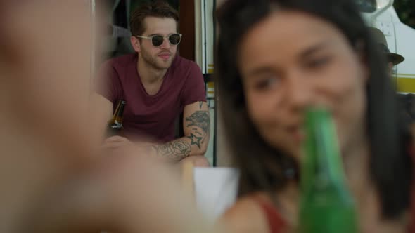 Group of young friends spending time on the camper side. Shot with RED helium camera in 8K