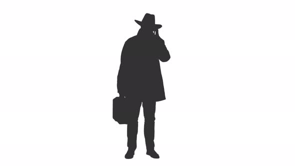 Silhouette of a Businessman in a Cowboy Hat Talking on Smartphone, Alpha Channel