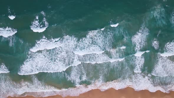 Top view tropical beach Amazing waves sea background. Crashing waves on beach sand, Beautiful sea