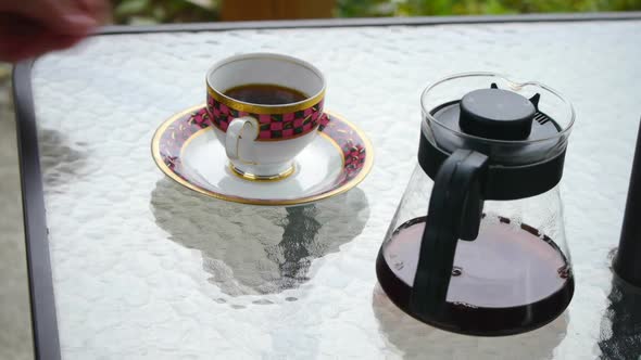 Static shot of coffee and cheese cake set placed on table