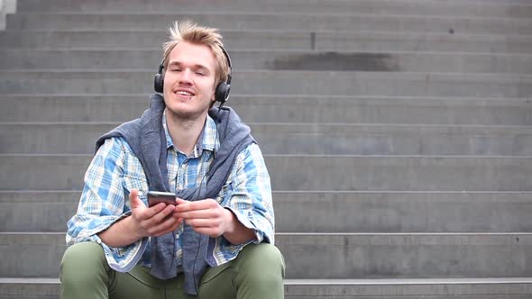 Young man relaxing and listening to music