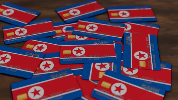 credit cards background with North Korea flag