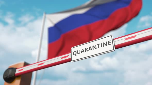 Barrier Gate with QUARANTINE Sign Being Open Near Flag of Russia