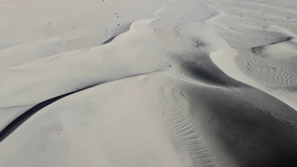 aerial top down view of sand dunes in the cold desert of Skardu Pakistan on a sunny summer day