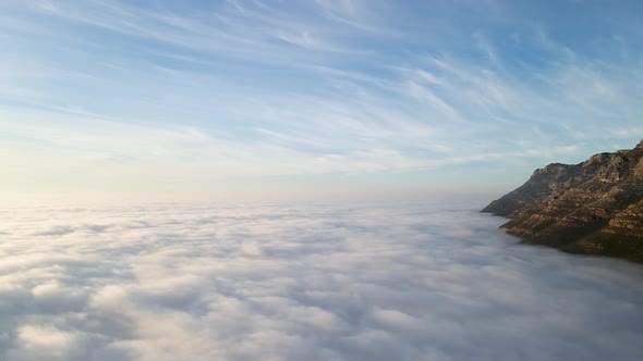 Aerial view of False bay covered in low cloud sunrise, Simonstown, Cape Town, South Africa.