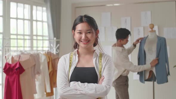 Young Asian Woman Dressmaker Smiling