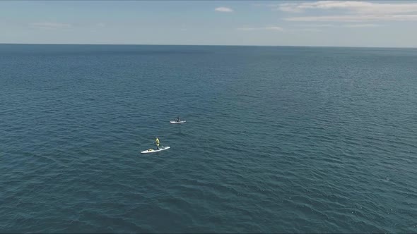 Aerial Drone Video of Sup Between 2 Men in Tropical Caribbean Waters