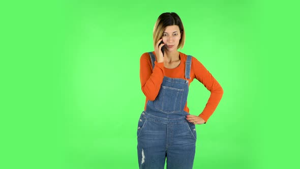 Girl Angrily Speaks on the Phone, Proves Something. Green Screen