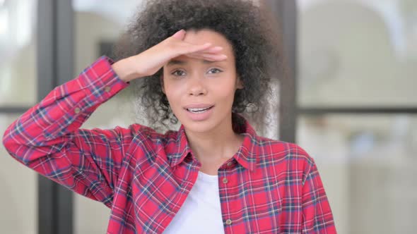 Portrait of African Woman Looking Around Searching