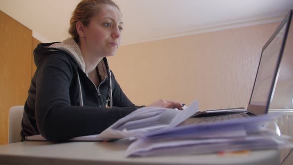 Accountant At The Table With Documents