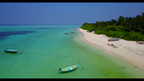 Aerial travel of perfect coastline beach time by blue green lagoon with white sandy background of a 