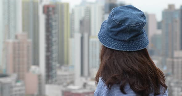 Woman look the city view in Hong Kong