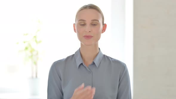 Portrait of Woman Giving Flying Kiss By Hands