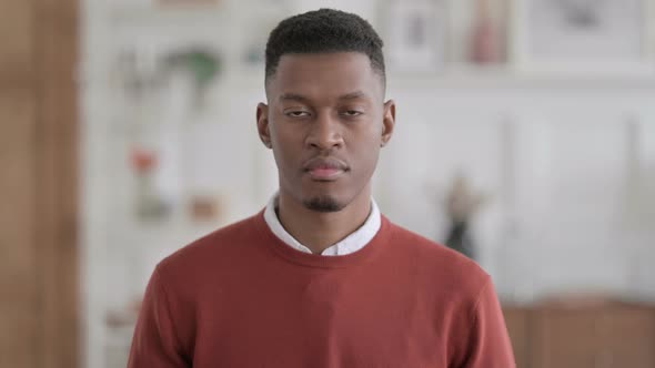 Portrait of African Man Looking at Camera at Home