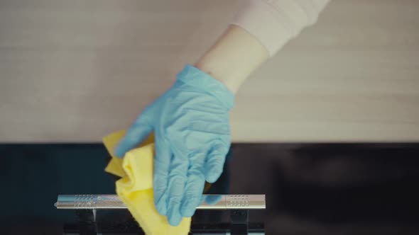 Vertical Video. Closeup of Woman Hands Using a Sanitizer and a Wet Towel for Disinfection Doors Knob