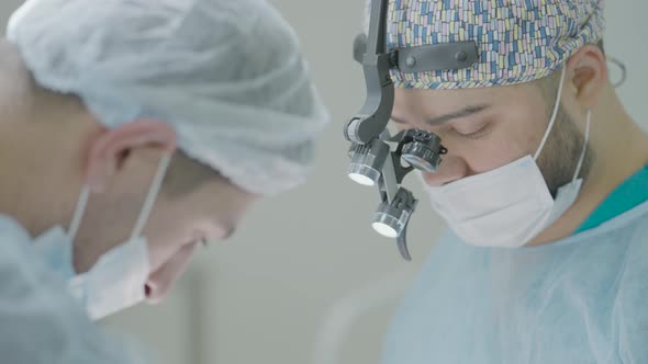 Two surgeons work together in operating room