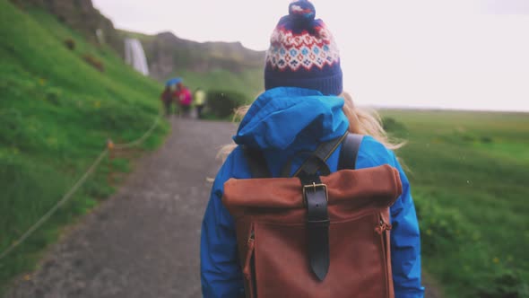 Back View of Young Attractive Woman Tourist Walking Outdoors Close Up