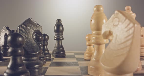 Special tracking macro shot moving between chess pieces on a chess board