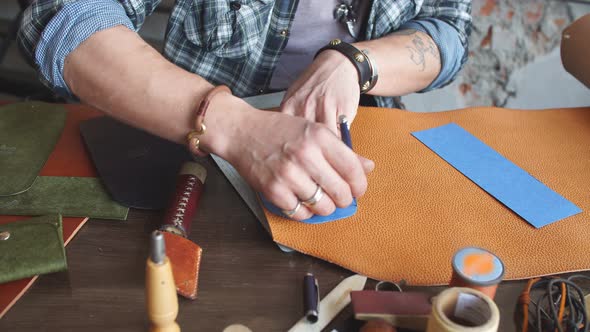 Young Hardworking Man Working with Leather Using Crafting Tools