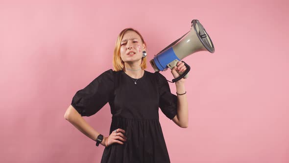 Feminism Concept. Portrait of Young Woman with Loudspeaker, Look at Camera