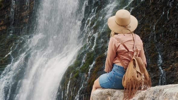 Woman Tourist Enjoying the View of the Waterfall