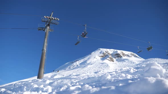 ski area in the Swiss alps with people and chairlifts in the winter ski area of ​​Beckenried