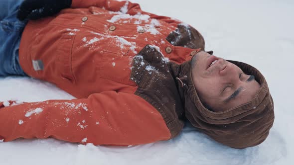 Frozen Man Lying on the Snow