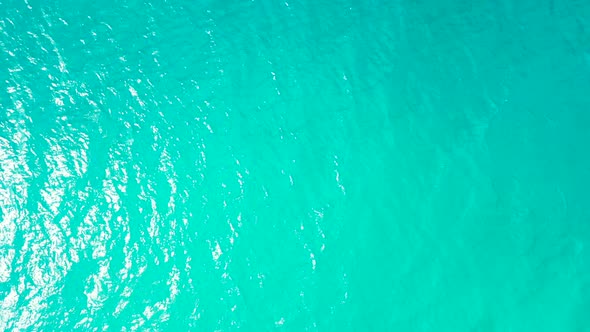 Beautiful drone clean view of a paradise sunny white sand beach and aqua blue ocean background