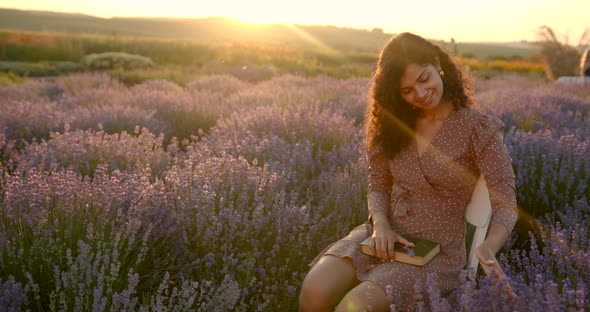 Indian Woman on Chair at Lavender Field in Summer